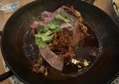 tupelo honey roasted pork on a dark plate
