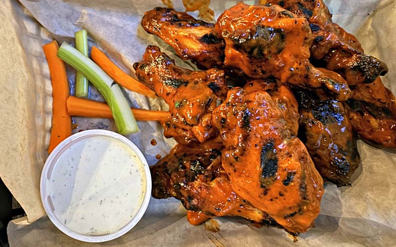 At Everett’s, time, brine and custom sauces make the chicken wings stand out