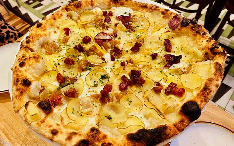Dolomiti Pizzeria and Enoteca's potato and pancetta topped Patata pizza