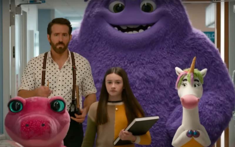 ryan reynolds and cailey Fleming lead a group of imaginary friends through a hospital