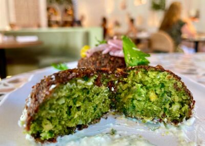 inside the clio falafel boasting vibrant green