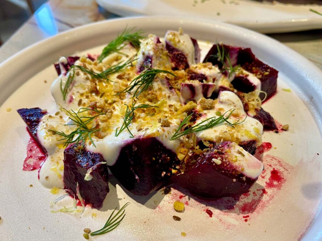 a plate of wood roated beets with whipped feta