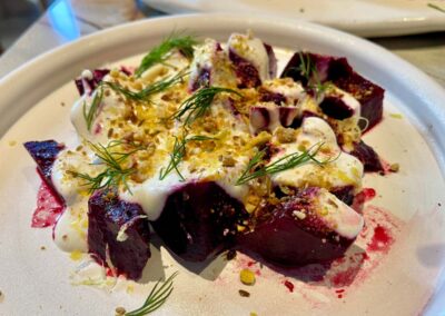 a plate of wood roated beets with whipped feta