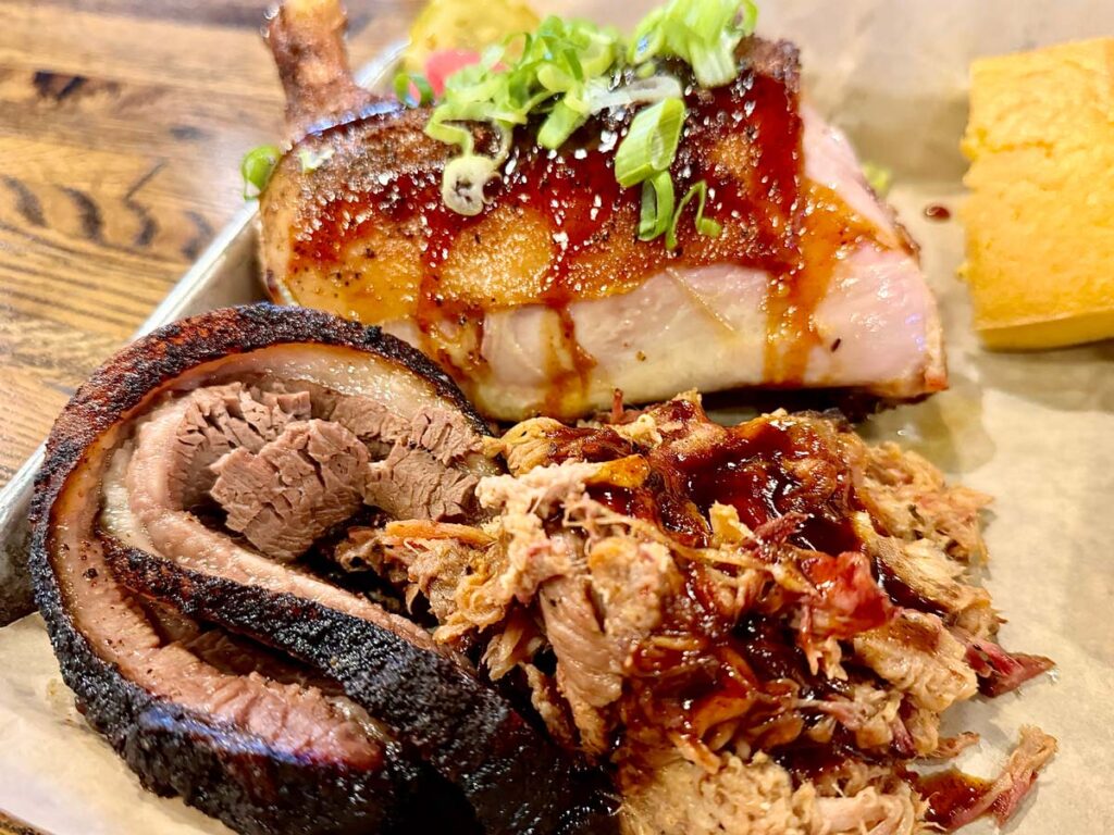 Porky Butts Meat Trio plate with Chicken Quarter, Brisket and Pulled Pork