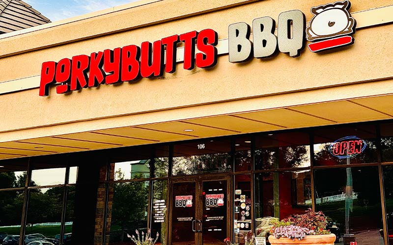 Exterior of Porky Butts front entrance with signage