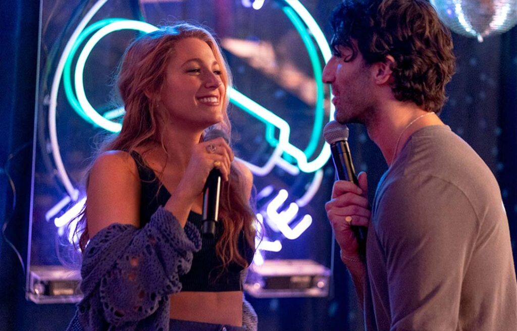 blake lively and justin baldoni singing karaoke in a nightclub