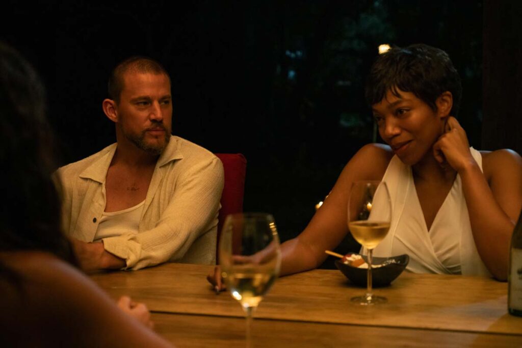 Channing Tatum and Naomi Ackie at a dinner table