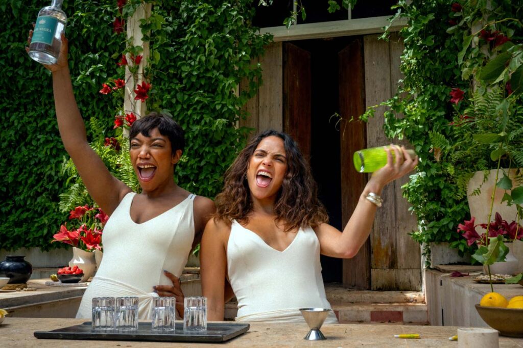 Naomi Ackie and Adria Arjona mix a tequila snake venom cocktail