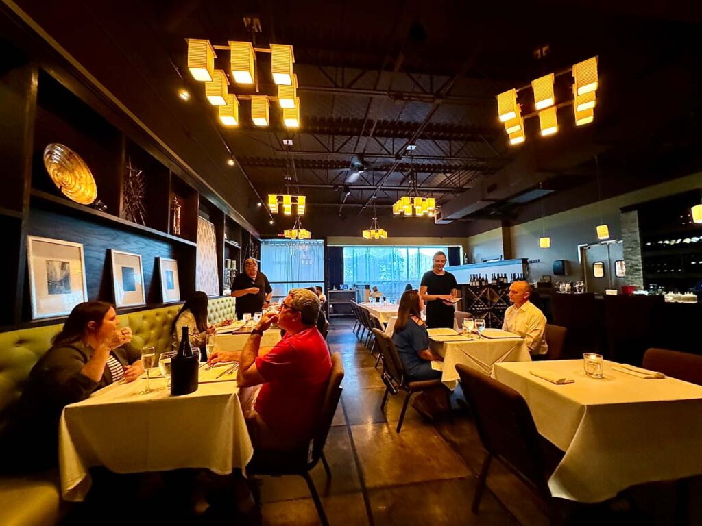 Dolce dining area with servers helping diners