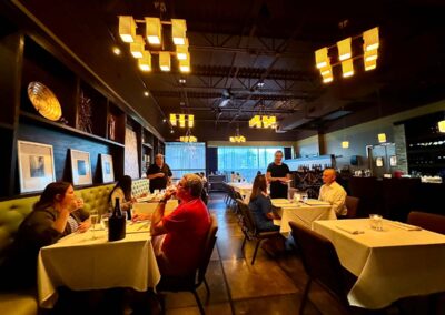 Dolce dining area with servers helping diners