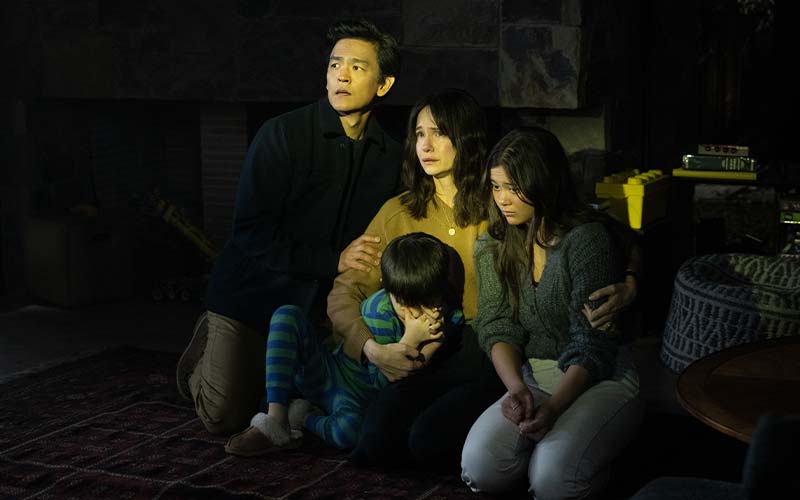 Afraid film review featured image features the cast huddled together in fear