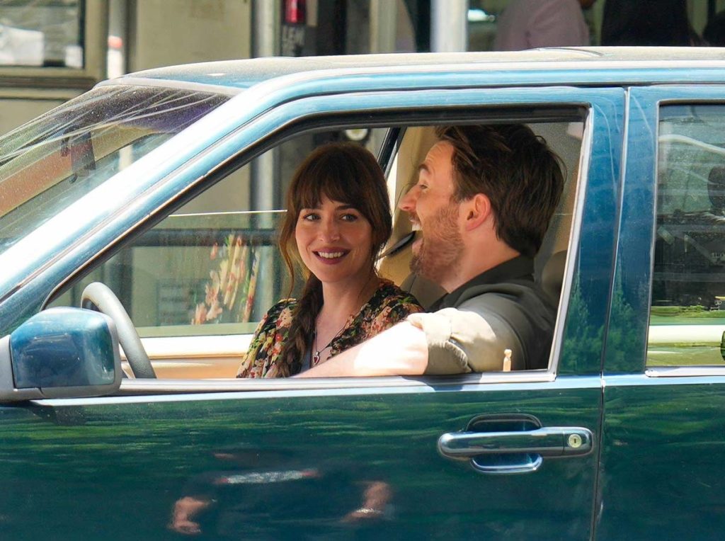 Dakota Johnson as Lucy and Chris Evans as John