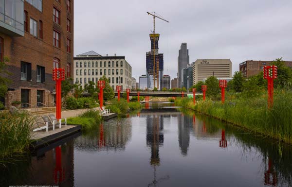 image of a beautiful home with a landscaped yard and curved driveway to highlight the street of dreams