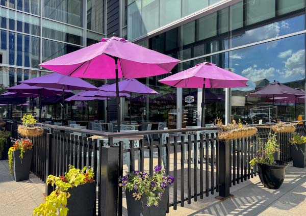 Herbe Sainte restaurant exterior corner and outdoor patio