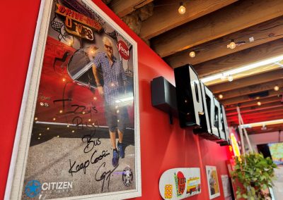 Guy Fieri - Keep cookin' sign on wall