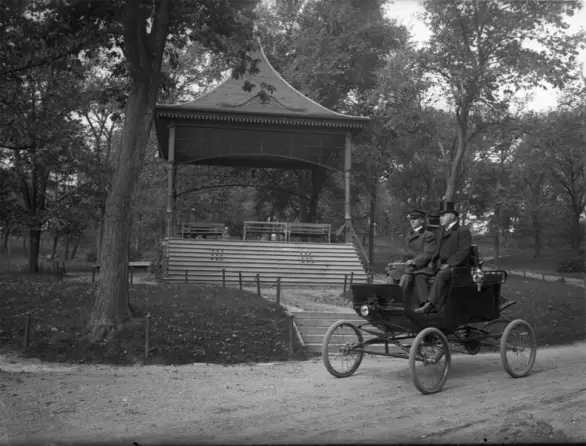 Motorized carriage driving through Omaha's Oldest Park