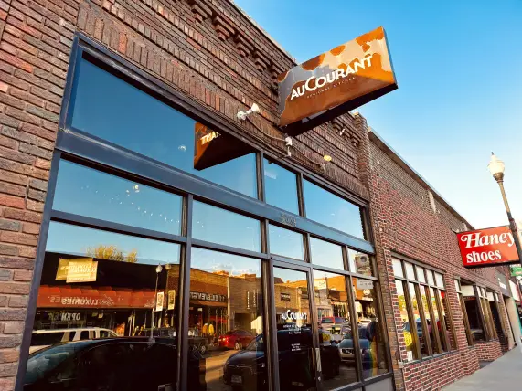 Au Courant exterior sign in the heart of Benson