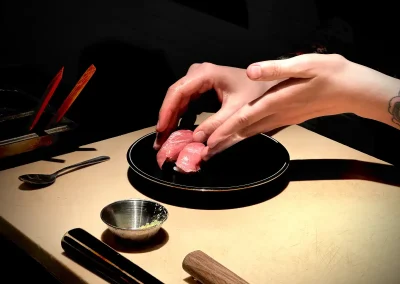 Plating sushi at Yoshitomo