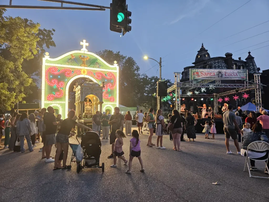 The Santa Lucia Festival with the statue lit up at night.