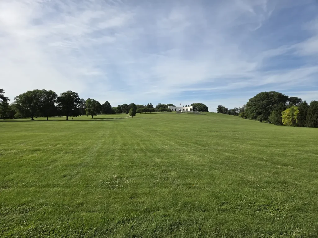2026 photo of Memorial Park looking north from Dodge Street. The memorial can be seen in the background.