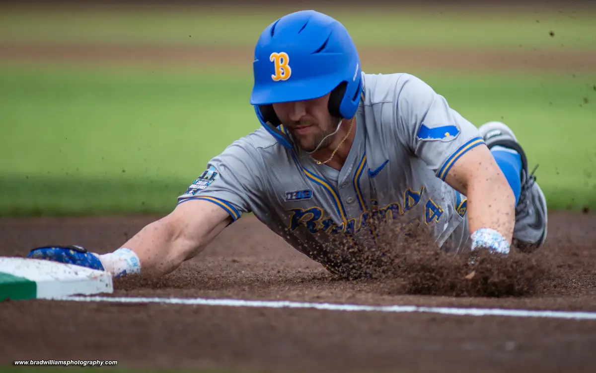 College World Series photo by Brad Williams of baserunner sliding to third base