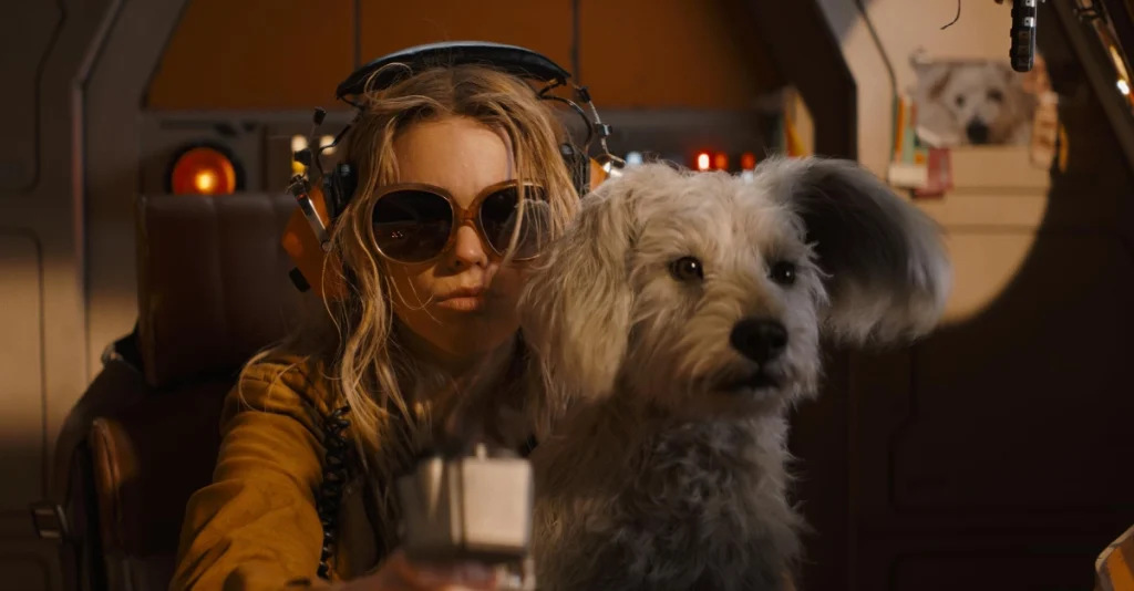 Milly Alcock as Supergirl with Krypto